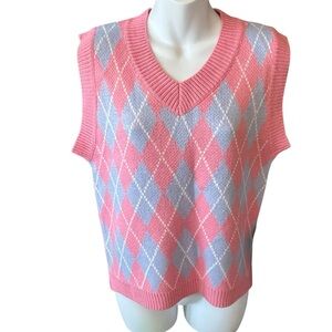 Small sweater vest in pink and blue.